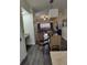 Open dining area with glass table and a view of the kitchen at 12521 Floridays Resort Dr # 207F, Orlando, FL 32821