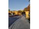 Landscaped entrance to a community with a sign and trees at 12521 Floridays Resort Dr # 207F, Orlando, FL 32821