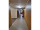 Residential hallway with access to various apartment units at 12521 Floridays Resort Dr # 207F, Orlando, FL 32821
