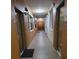 Building hallway with access to apartment units and amenities at 12521 Floridays Resort Dr # 207F, Orlando, FL 32821