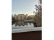 Scenic lake view with building reflection and landscaping at 12521 Floridays Resort Dr # 207F, Orlando, FL 32821