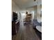 Open concept living and dining area with hardwood floors at 12521 Floridays Resort Dr # 207F, Orlando, FL 32821