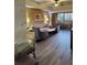 Living room with gray sofa and access to a balcony at 12521 Floridays Resort Dr # 207F, Orlando, FL 32821