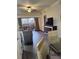Spacious living area features hardwood floors and balcony access at 12521 Floridays Resort Dr # 207F, Orlando, FL 32821