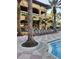 Resort-style pool with lounge chairs and a checkered patio at 12521 Floridays Resort Dr # 207F, Orlando, FL 32821