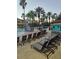 Spacious pool deck with numerous lounge chairs at 12521 Floridays Resort Dr # 207F, Orlando, FL 32821