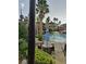 Relaxing pool area with patio furniture and umbrellas at 12521 Floridays Resort Dr # 207F, Orlando, FL 32821