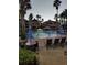 Resort-style pool with lounge chairs and umbrellas at 12521 Floridays Resort Dr # 207F, Orlando, FL 32821