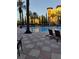 Relaxing pool area with lounge chairs and building view at 12521 Floridays Resort Dr # 207F, Orlando, FL 32821