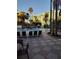 Community pool with palm trees and lounge chairs at 12521 Floridays Resort Dr # 207F, Orlando, FL 32821