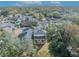 Aerial view of the property showing the home, surrounding trees, and neighborhood, highlighting its location at 1445 Creekside Cir, Winter Springs, FL 32708