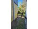 Fenced side yard with a narrow grassy area between two buildings at 1445 Creekside Cir, Winter Springs, FL 32708