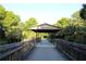 Scenic bridge and walkway, offering a picturesque view and access to natural surroundings at 1445 Creekside Cir, Winter Springs, FL 32708