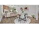 Bright living area showcasing wood floors, fireplace, modern furniture, and abundant natural light at 1445 Creekside Cir, Winter Springs, FL 32708