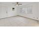 Simple bedroom with tile floors, a ceiling fan, and a window with blinds at 250 Silas Phelps Ct, Orlando, FL 32828