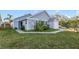 Cute blue house with a well-maintained lawn and a white picket fence at 250 Silas Phelps Ct, Orlando, FL 32828