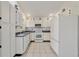 White kitchen with appliances and tile floor at 250 Silas Phelps Ct, Orlando, FL 32828