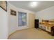 Home office with built-in desk and tile floors at 250 Silas Phelps Ct, Orlando, FL 32828