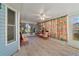 Relaxing sunroom with tile floors and colorful curtains at 250 Silas Phelps Ct, Orlando, FL 32828