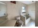 Clean bathroom with bathtub and tiled floor at 2663 Magnolia Rd, Deland, FL 32720
