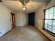 Empty bedroom with a large window and closet at 2663 Magnolia Rd, Deland, FL 32720