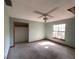 Spacious bedroom with ceiling fan and large window at 2663 Magnolia Rd, Deland, FL 32720