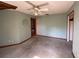 Large bedroom with ceiling fan and ample space at 2663 Magnolia Rd, Deland, FL 32720