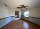 Empty dining room with hardwood floors and a view of the kitchen at 2663 Magnolia Rd, Deland, FL 32720