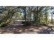 House exterior showcasing a carport and tree-lined street at 2663 Magnolia Rd, Deland, FL 32720