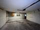 Spacious garage with overhead door and storage at 2663 Magnolia Rd, Deland, FL 32720