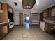Kitchen needing updates, featuring wood cabinets and a breakfast nook at 2663 Magnolia Rd, Deland, FL 32720