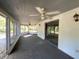 Spacious screened porch with ceiling fans and sliding glass doors at 2663 Magnolia Rd, Deland, FL 32720