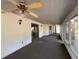 Large screened porch featuring ceiling fans and access to the backyard at 2663 Magnolia Rd, Deland, FL 32720