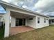 Covered patio with brick pavers and access to the backyard at 2817 Willowseed Ln, Saint Cloud, FL 34772