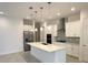 Modern kitchen with large island and stainless steel appliances at 5031 Dancy Ln, Saint Cloud, FL 34772