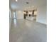 Open living room with modern kitchen and island at 5031 Dancy Ln, Saint Cloud, FL 34772