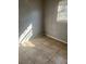 Simple bedroom with tile flooring and neutral walls at 5465 Lescot Ln, Orlando, FL 32811