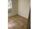 Simple bedroom with tile flooring and neutral walls at 5465 Lescot Ln, Orlando, FL 32811