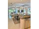 Open-concept living space featuring a modern kitchen, dining area, and comfortable living room at 7652 Whisper Way # 104, Reunion, FL 34747