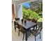 Charming outdoor patio with a dining table and chairs, perfect for enjoying meals outside at 7652 Whisper Way # 104, Reunion, FL 34747