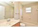 Traditional bathroom with a vanity, mirror, tub and shower combination with neutral-colored tiling at 77 Spring Glen Dr, Debary, FL 32713
