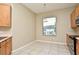 Bright dining area with tile floors and large windows offering plenty of natural light at 77 Spring Glen Dr, Debary, FL 32713