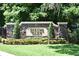 Stone monument sign for Spring Glen community with manicured landscaping and mature trees at 77 Spring Glen Dr, Debary, FL 32713