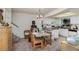 Small dining area with glass-top table and chairs, adjacent to kitchen at 159 Sweetgum Ln, Port Orange, FL 32129