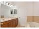 Double vanity bathroom with soaking tub at 1728 Travertine Ter, Sanford, FL 32771