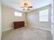 Spacious bedroom with neutral walls and a dresser at 2506 Volunteer Ave, Kissimmee, FL 34744
