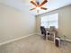 Bright bedroom with carpeted floors and a workspace at 2506 Volunteer Ave, Kissimmee, FL 34744