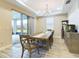Formal dining room with a large wooden table, chairs, and access to a patio at 2506 Volunteer Ave, Kissimmee, FL 34744