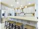 Modern kitchen with stainless steel appliances and a large island with seating at 2506 Volunteer Ave, Kissimmee, FL 34744