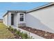 Side view of one story home showcasing walkway and landscaping at 2522 Linda Knoll Ln, Bartow, FL 33830